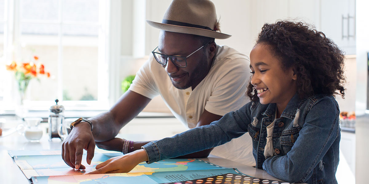 Father helping daughter with homework